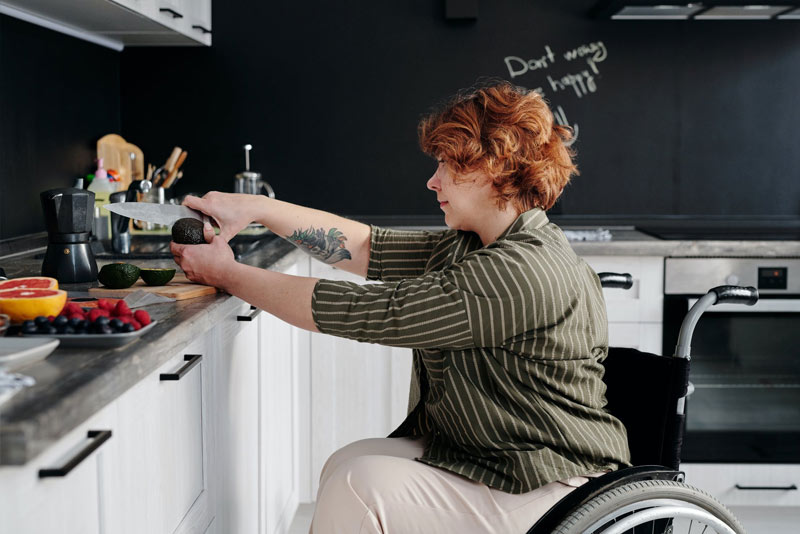 Woman with Disability Cooking in her own kitchen