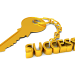 A golden success key chain and key