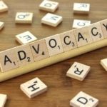Advocacy spelled out with Scrabble game tiles