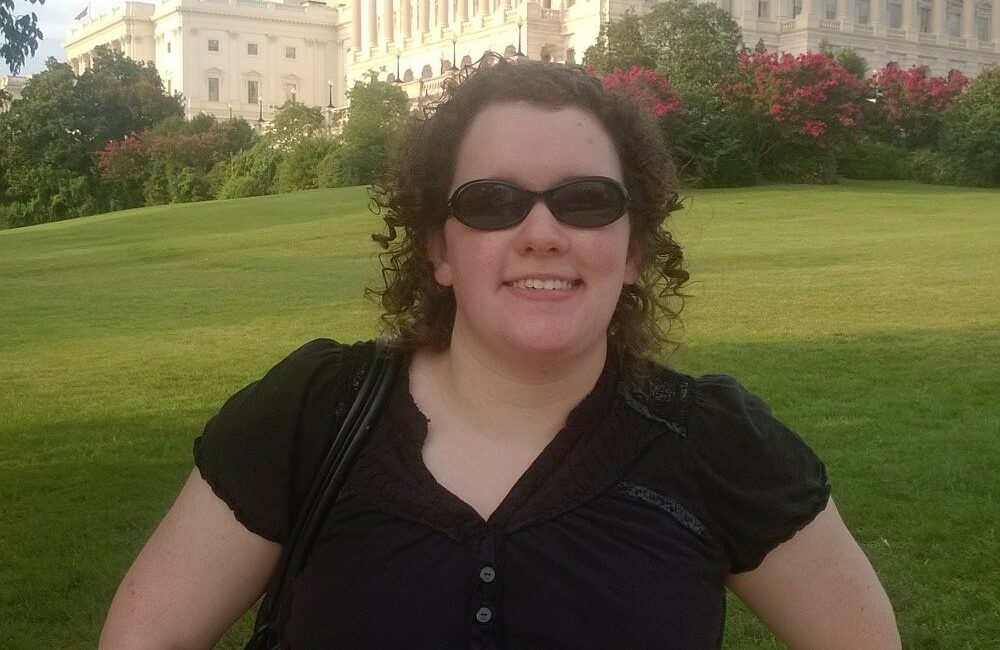 Picture of ECI staff member Amy Ouellette in front of the U.S. Capitol Building in Washington D.C.