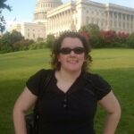 Picture of ECI staff member Amy Ouellette in front of the U.S. Capitol Building in Washington D.C.