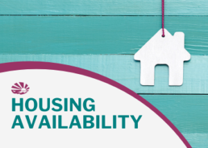 Figurine of a house hanging in front of teal and wooden wall. The words HOUSING AVAILABILITY appear in the bottom left. The ECI logo is above the text.