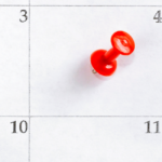 Calendar with pin marking date